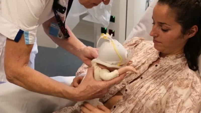 Buideldoek buikligging instructie